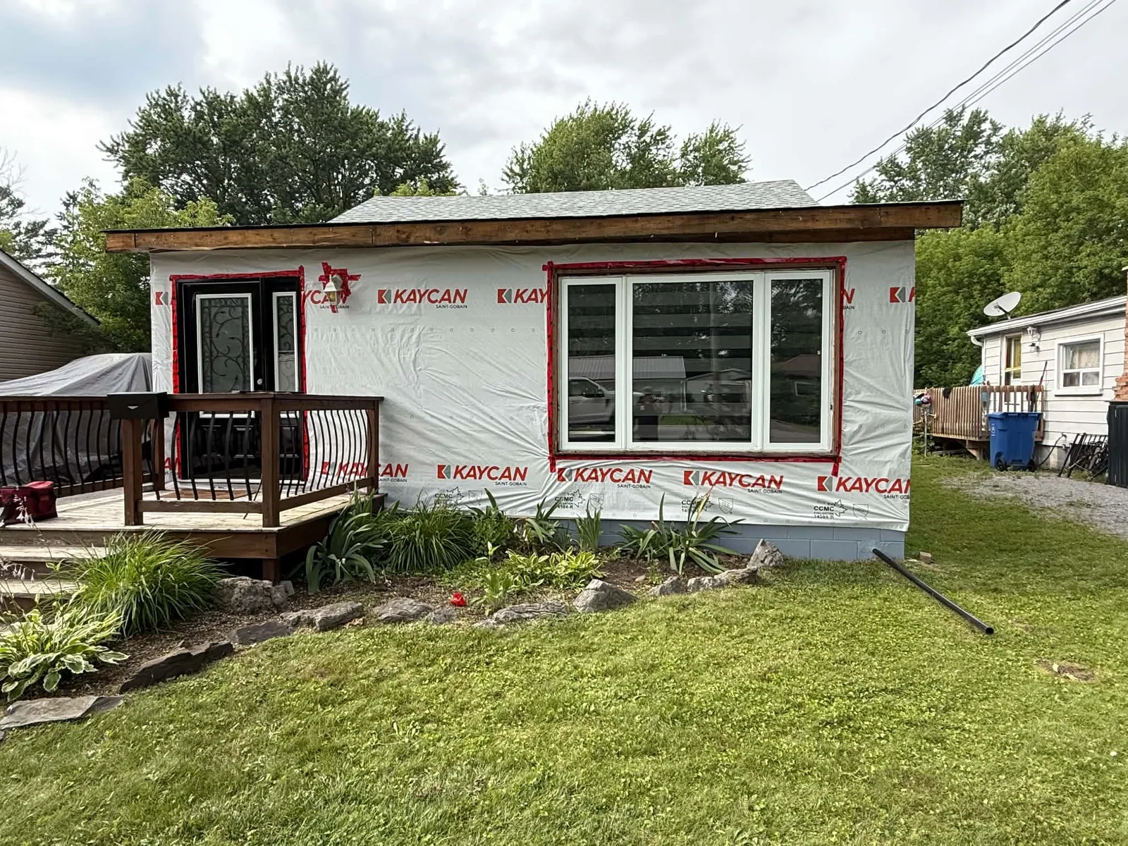 Front elevation covered in housewrap during preparation for new siding.