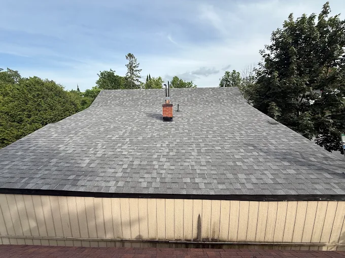 Finished asphalt shingle roof viewed across the completed surface.