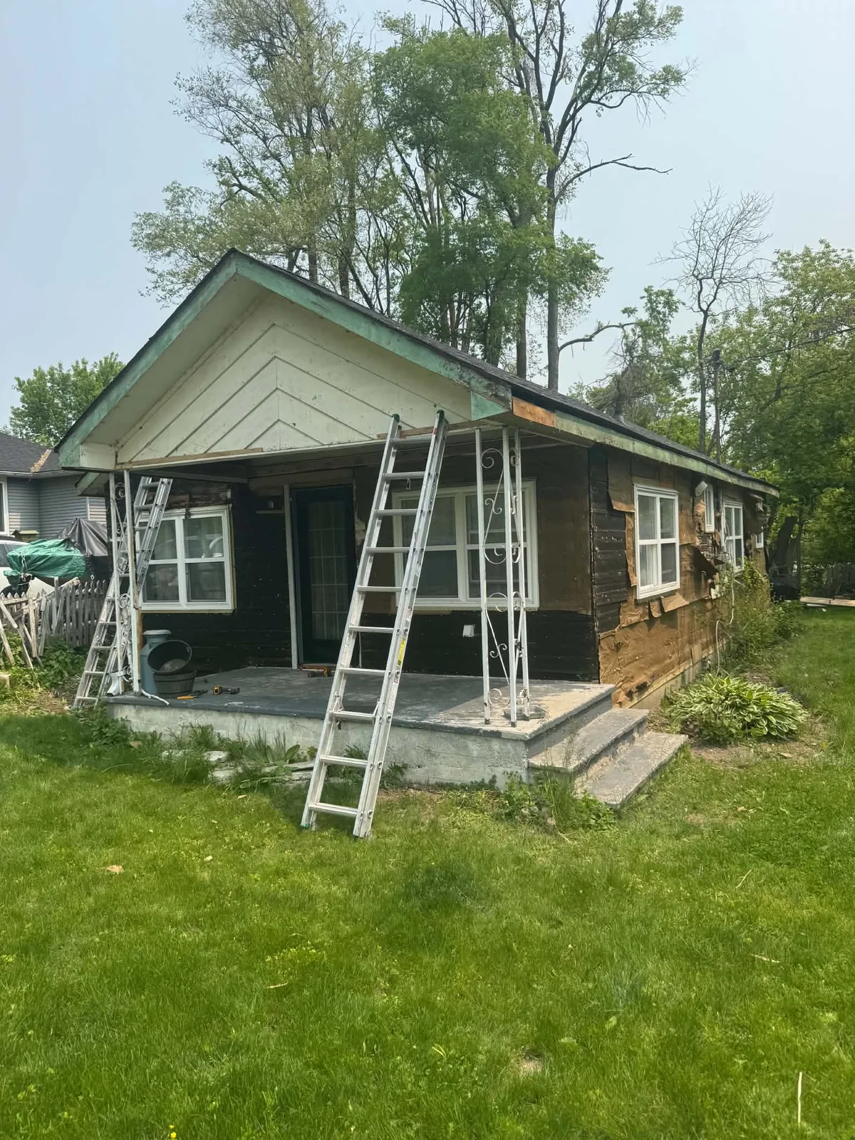 Exterior wall exposed during removal of the original cottage siding.